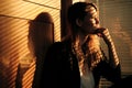 Business Woman Standing By Window With Venetian Blinds