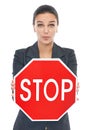 Business woman, stop sign and white background for safety campaign at work for human resources. Professional female Royalty Free Stock Photo