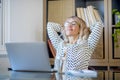 Business woman stretch and smile for success and satisfaction work job activity at home office. Modern female people in front of a Royalty Free Stock Photo