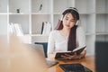 Business woman student teacher tutor wear wireless headset video conference calling on laptop computer Royalty Free Stock Photo