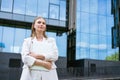 Business woman business success. Charming beautiful woman is holding a laptop