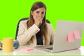 Business woman suffering stress at office computer green chroma key Royalty Free Stock Photo