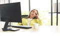 Business woman suffering stress working computer and a cup of coffee on the table / Stressed woman tired with headache at office Royalty Free Stock Photo