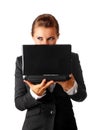 Business woman suspicious looks out from laptop Royalty Free Stock Photo