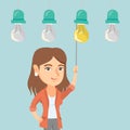 Business woman switching on hanging idea bulb.