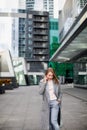 Business woman talking on the phone in the background of an office building Royalty Free Stock Photo