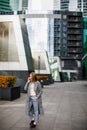 Business woman talking on the phone in the background of an office building Royalty Free Stock Photo