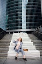 Business woman talking on the phone in the background of an office building Royalty Free Stock Photo