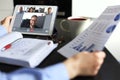 Business woman talking to her colleagues in video conference. Business team working from home using digital tablet Royalty Free Stock Photo