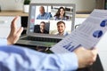 Business woman talking to her colleagues in video conference. Business team working from home using laptop Royalty Free Stock Photo