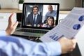 Business woman talking to her colleagues in video conference. Business team working from home using laptop. Royalty Free Stock Photo