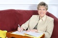 Business Woman or Teacher Working at Home on Couch Royalty Free Stock Photo
