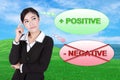 Business woman thinking about positive with green grass field an Royalty Free Stock Photo