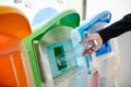 Business woman throwing empty plastic bottle water into recycle garbage trash Royalty Free Stock Photo