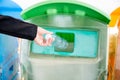 Business woman throwing empty plastic bottle water into recycle garbage trash Royalty Free Stock Photo