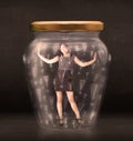 Business woman trapped in jar with exclamation marks concept