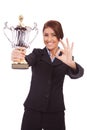 Business woman with trophy make ok gesture