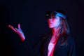 Business woman try vr glasses hololens in the dark room | Portrait of young asian girl experience ar | Future technology concept