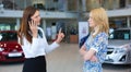 Business woman trying to calm down dissatisfied customer woman