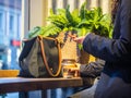 Business woman typing text message on smart phone in a cafe, Close up of female hands holding cell telephone Royalty Free Stock Photo