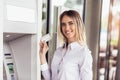 Woman using ATM.Woman using credit card to withdrawing money from atm machine Royalty Free Stock Photo