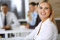 Business woman using computer at workplace in modern office. Secretary or female lawyer smiling and looks happy. Working Royalty Free Stock Photo