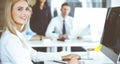 Business woman using computer at workplace in modern office. Secretary or female lawyer smiling and looks happy. Working Royalty Free Stock Photo