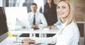 Business woman using computer at workplace in modern office. Secretary or female lawyer smiling and looks happy. Working Royalty Free Stock Photo