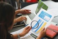 Business woman using magnifying glass to check contract financial documents Royalty Free Stock Photo