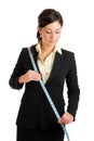 Business woman using a measuring tape Royalty Free Stock Photo