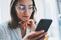 Business woman using mobile phone at working day in office.Blurred background. Business Technology Communications Royalty Free Stock Photo