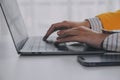 Business woman using mobile phone during working on laptop computer, surfing the internet, searching business data at modern Royalty Free Stock Photo