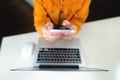 Business woman using mobile smart phone and working on laptop computer with digital tablet on office table at home Royalty Free Stock Photo