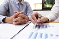 Business woman is using a pen for financial data analyzing counting Royalty Free Stock Photo