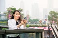 Business woman using phone outside office Royalty Free Stock Photo