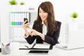 Business woman using the smart phone in office Royalty Free Stock Photo