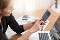 Business woman using smart phone to shopping online in cafe Royalty Free Stock Photo