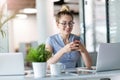 Business woman using smartphone in office Royalty Free Stock Photo