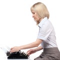 Business woman with vintage typing machine