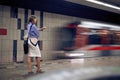 Business woman waiting for metro in subway.Woman waiting for a train in metro