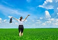 Business woman walk on green grass field outdoor and relax under sun. Beautiful young girl dressed in suit resting, spring landsca Royalty Free Stock Photo