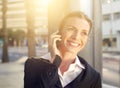 Business woman walking and talking on mobile phone Royalty Free Stock Photo