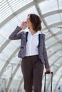 Business woman walking and talking on mobile phone Royalty Free Stock Photo