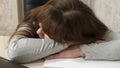 Business woman was weakened at work and fell asleep at a computer. close-up. tired office worker sleeps on documents at Royalty Free Stock Photo