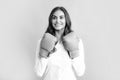 Business woman wearing boxing gloves ready to fight. Strength, power or competition concept. Woman in boxing gloves. Royalty Free Stock Photo