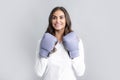 Business woman wearing boxing gloves ready to fight. Strength, power or competition concept. Woman in boxing gloves. Royalty Free Stock Photo