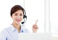 business Woman wearing headset in office Royalty Free Stock Photo