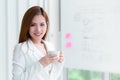Business woman in white is holding coffee cup in meeting r Royalty Free Stock Photo