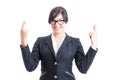Business woman wishing for luck with crossed fingers