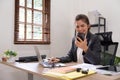 Business woman worker looking at smartphone using cellphone mobile laptop working at office check cell phone sitting at Royalty Free Stock Photo